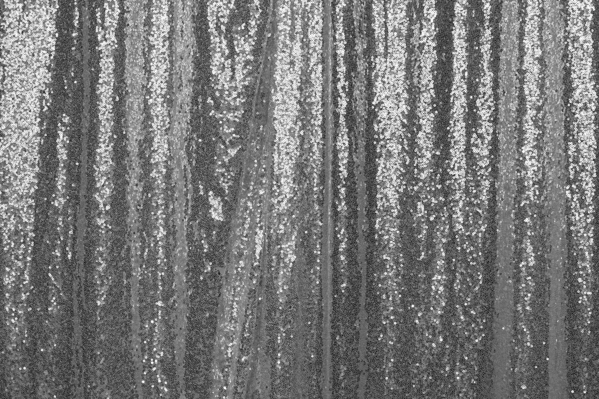Sequin curtain. A silver curtain made from sequins for photo props background.